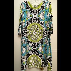 Beautiful and brightly colored dress! It is turquoise, lime green, white & black